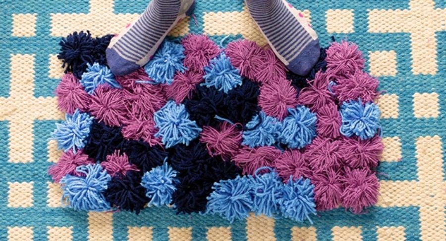 tapete con pompones de estambre
